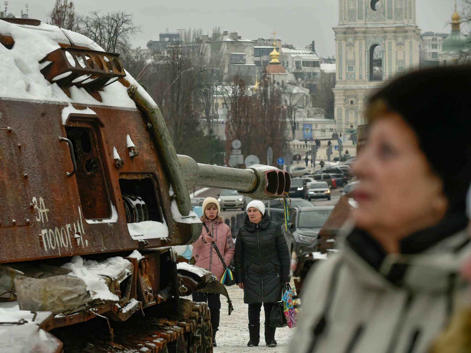 Photo walking by a disused Russian tank in Kyiv on Jan. 13