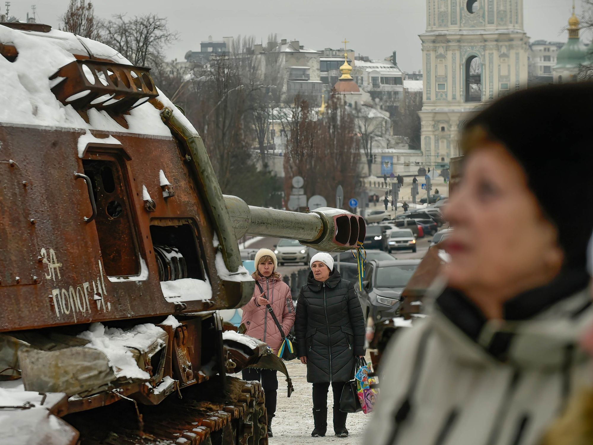 Photo walking by a disused Russian tank in Kyiv on Jan. 13