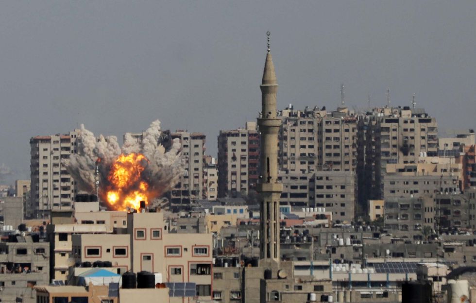 Photograph of a building exploding during an Israeli airstrike.