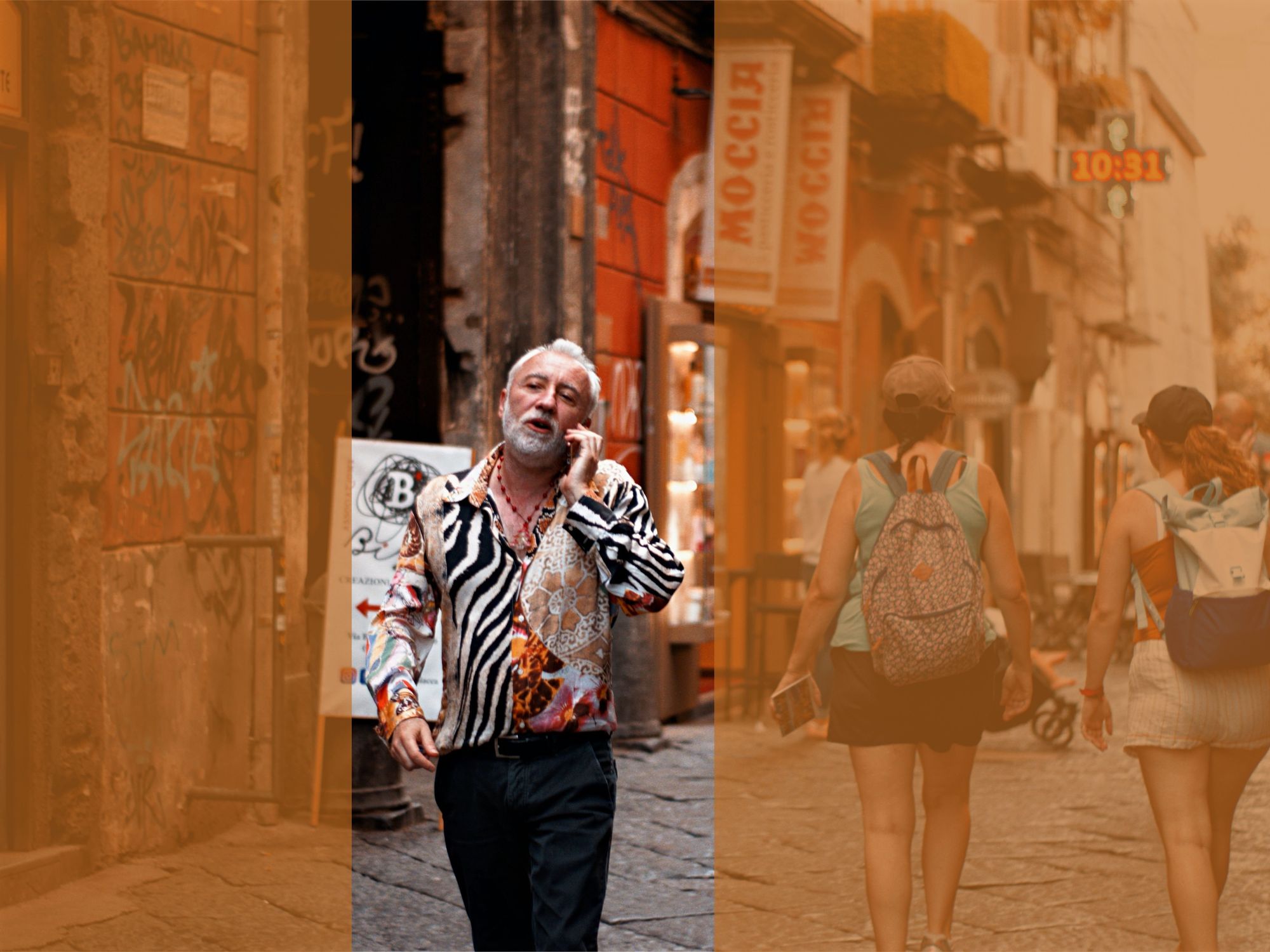 Photograph of a man in a zebra print shirt walking down a Neapolitan street. He is talking on the phone.