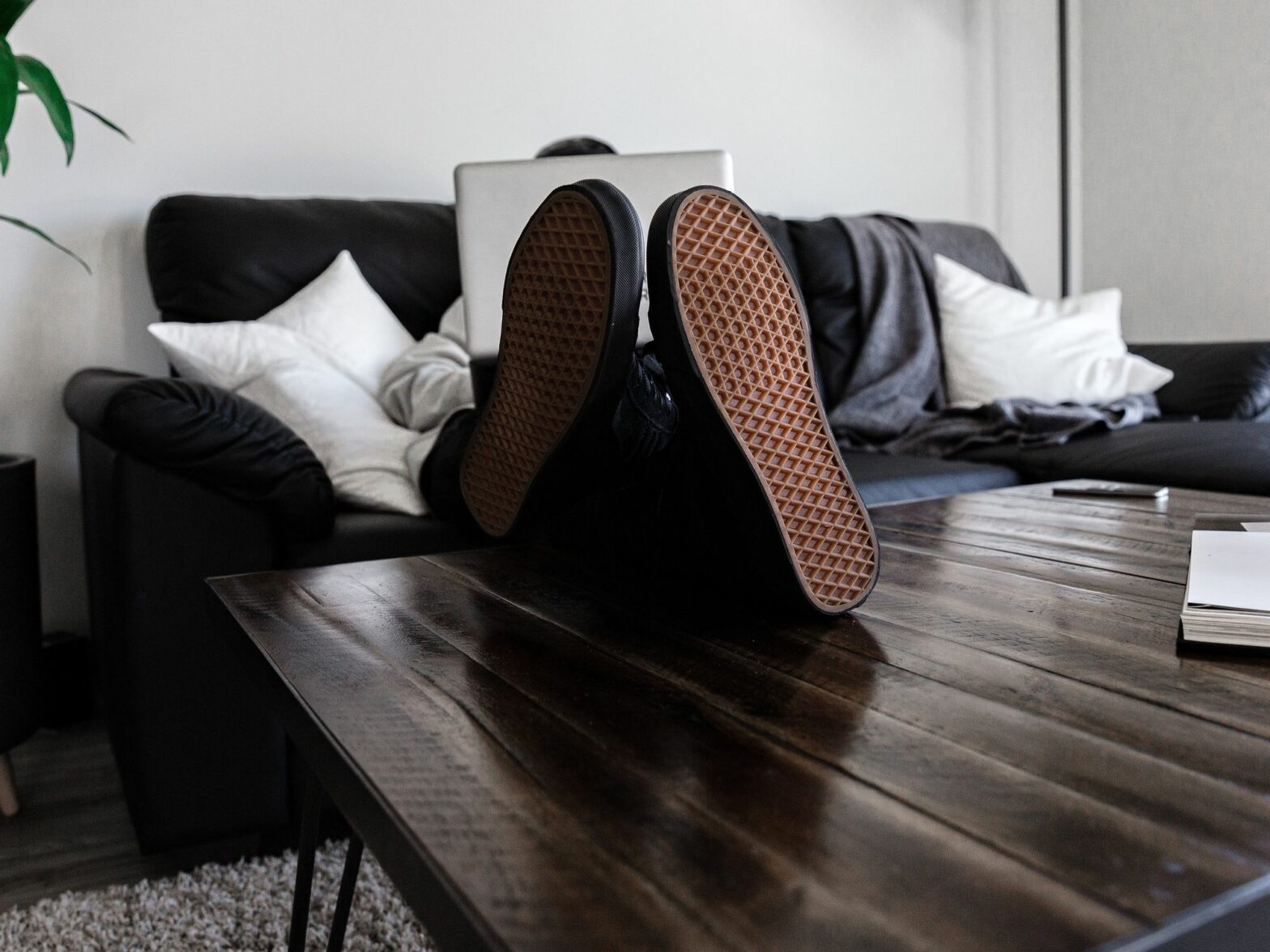 Photograph of a person's soles as they sit cross legged in the office