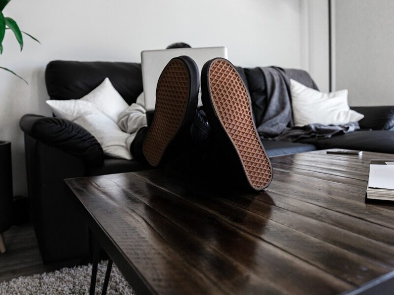 Photograph of a person's soles as they sit cross legged in the office