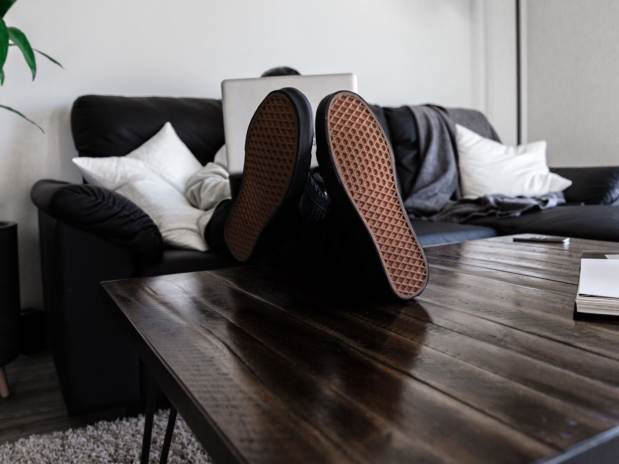 Photograph of a person's soles as they sit cross legged in the office