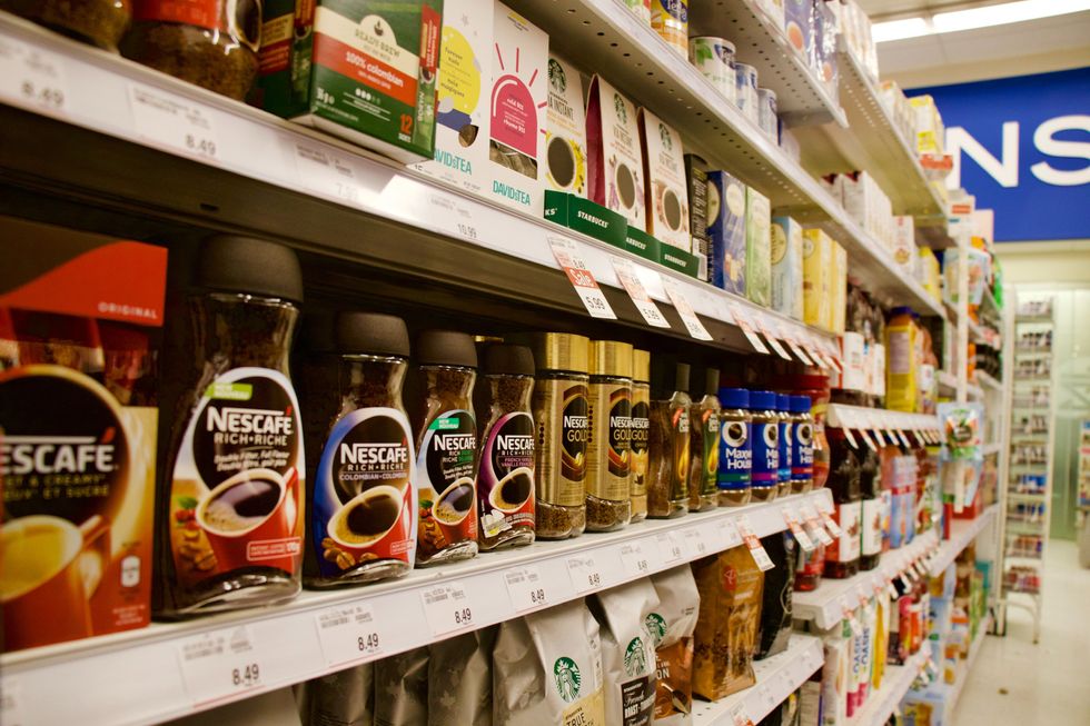 Photograph of an aisle filled with coffee in a supermarket