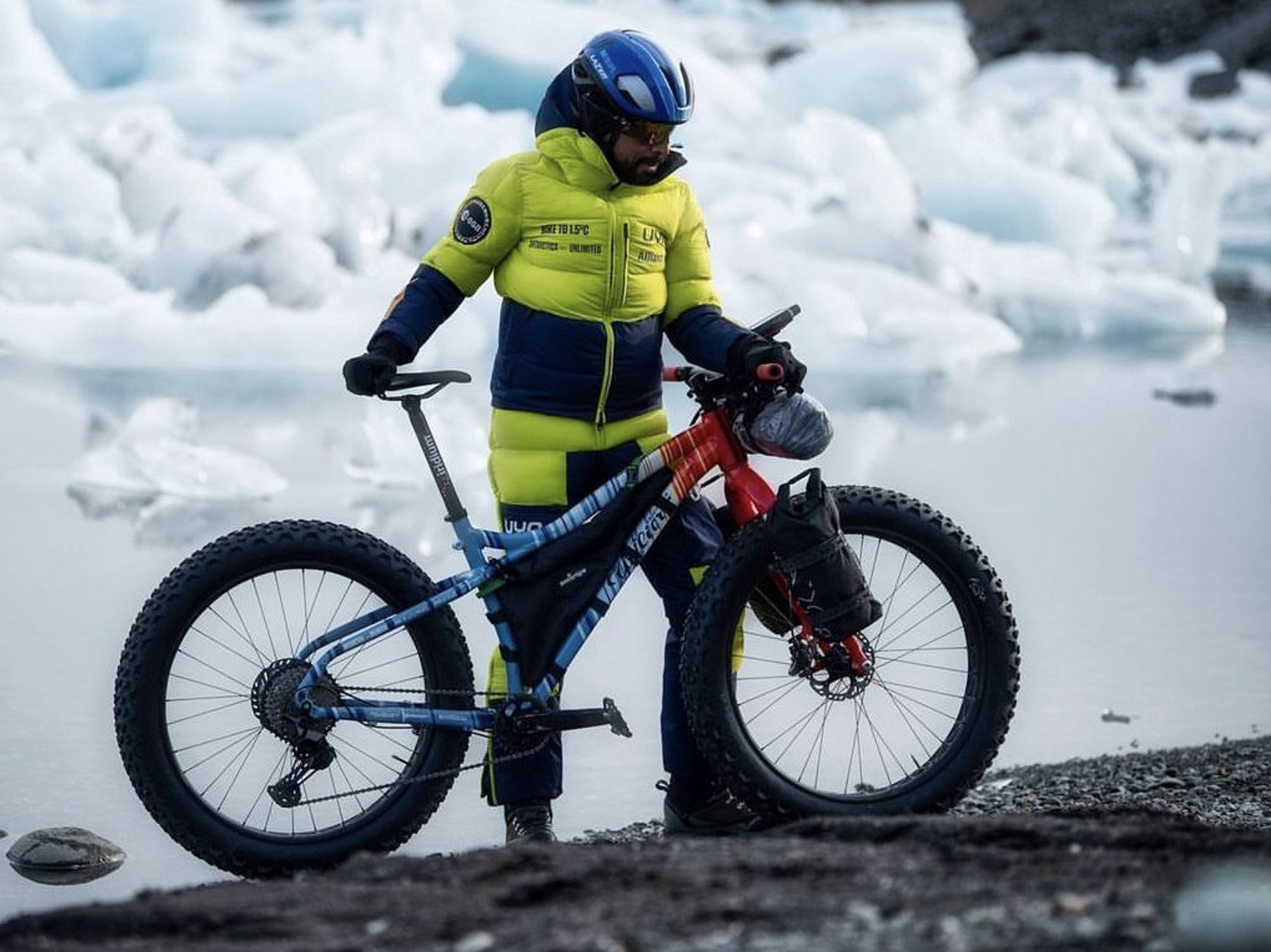 Photograph of ​Omar Di Felice in Antarctica with his bike.