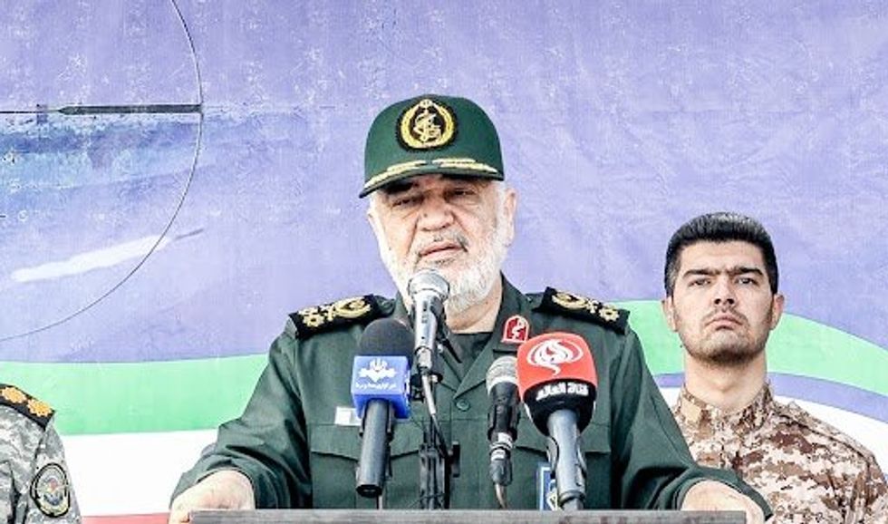 Photograph of general Hossein Salami, addressing troops during a massive military drill on the island of Abu Musa.