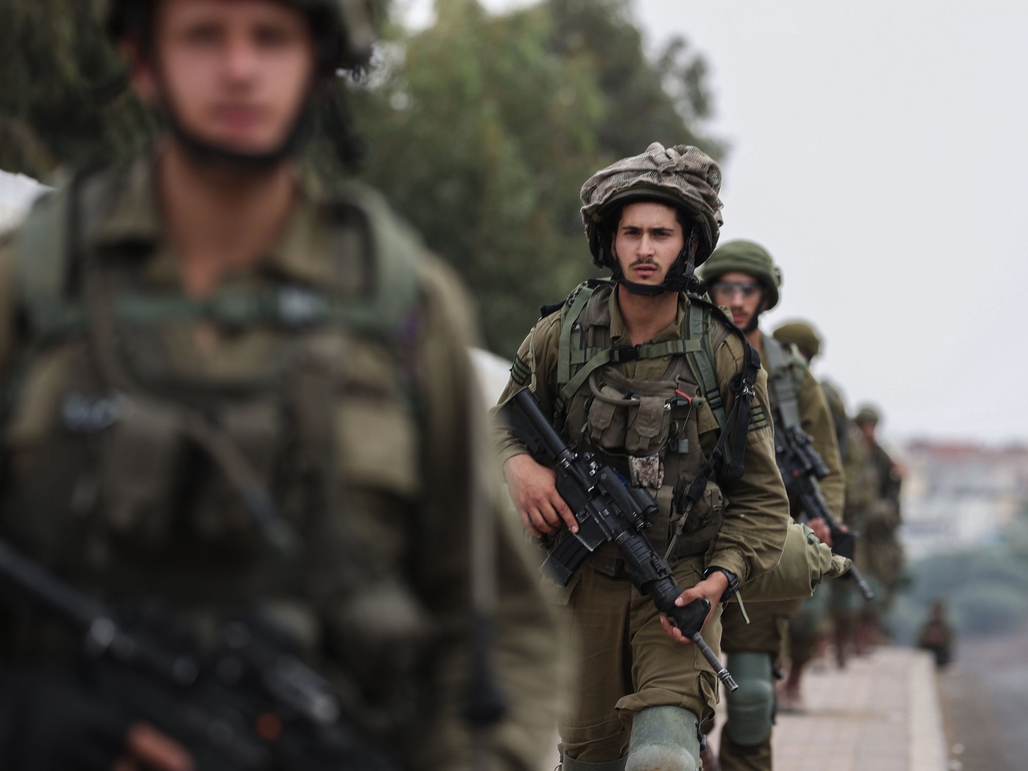 Photograph of Israeli soldiers walking in full gear