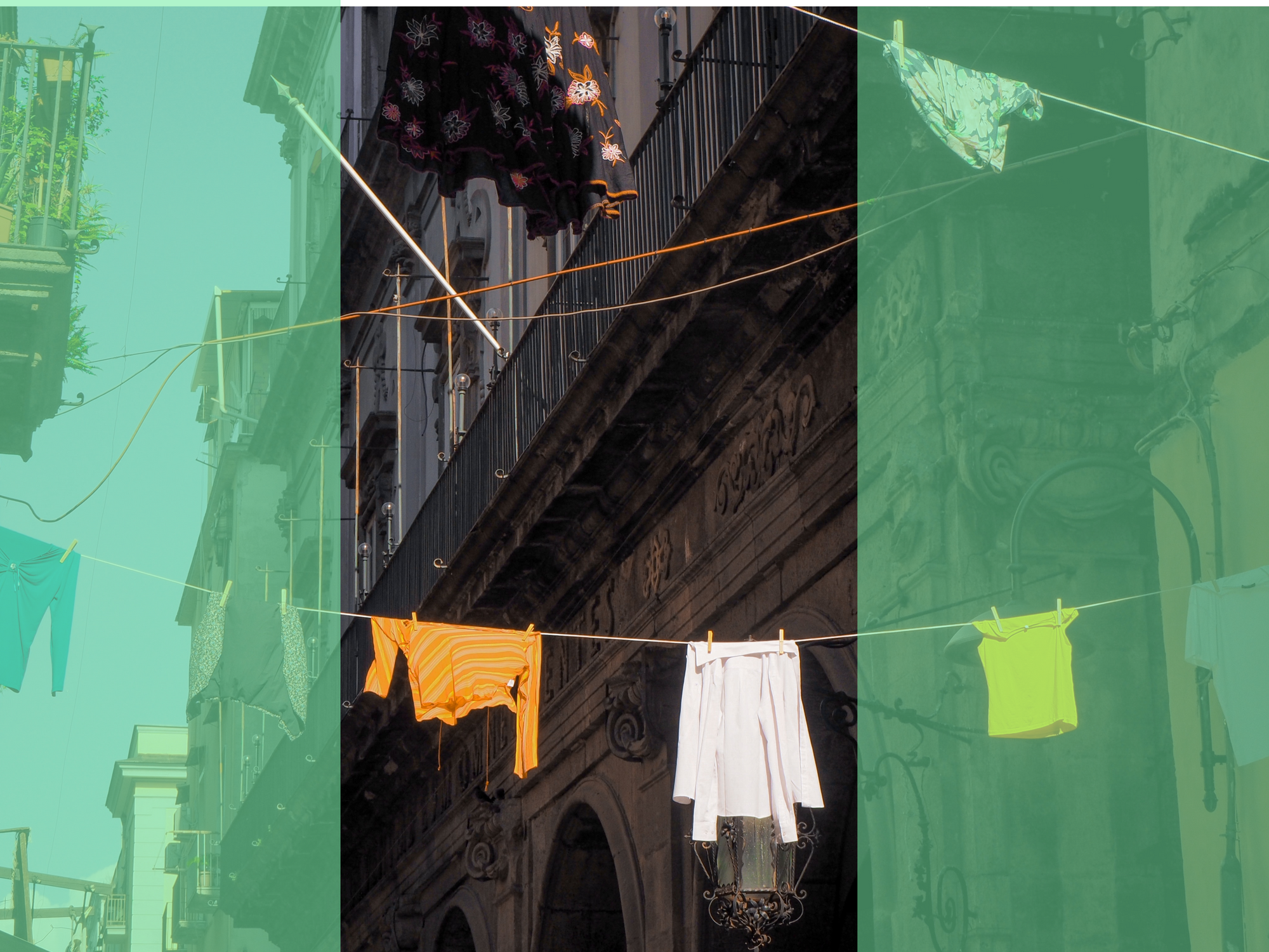 Photograph of laundry hanging on a line between buildings in Naples, Italy.