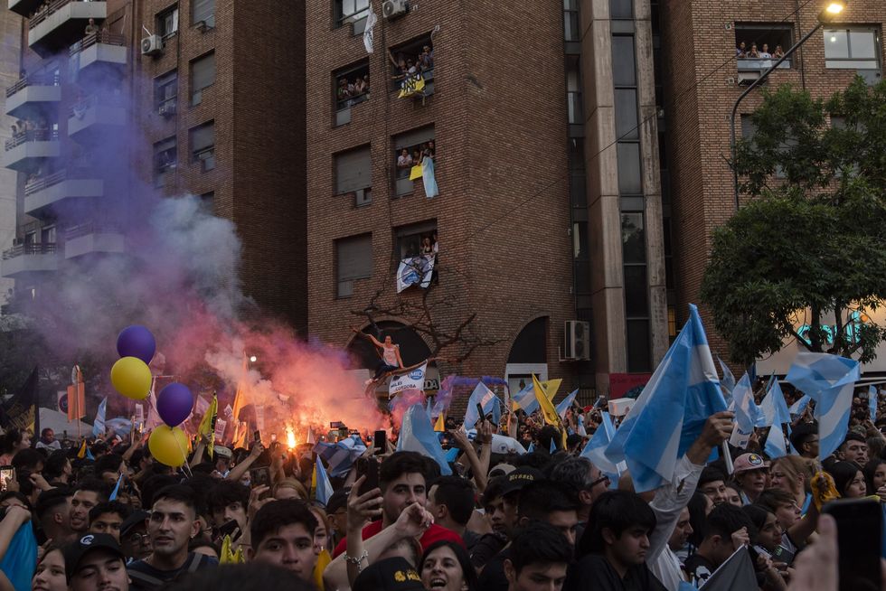 Photograph of Libertarian followers at a rally as they await the presidential candidate of La Libertad Avanza Javier Milei.