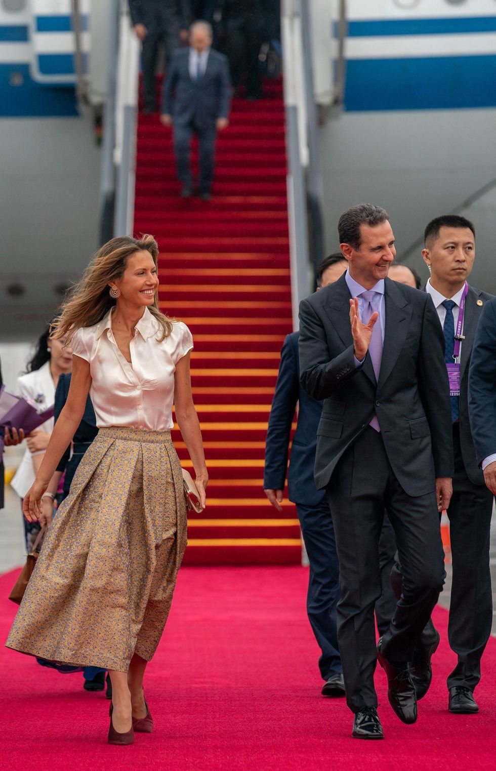 Photograph of Syria's President Bashar al-Assad and First Lady Asma al-Assad arriving at the airport in Beijing​.