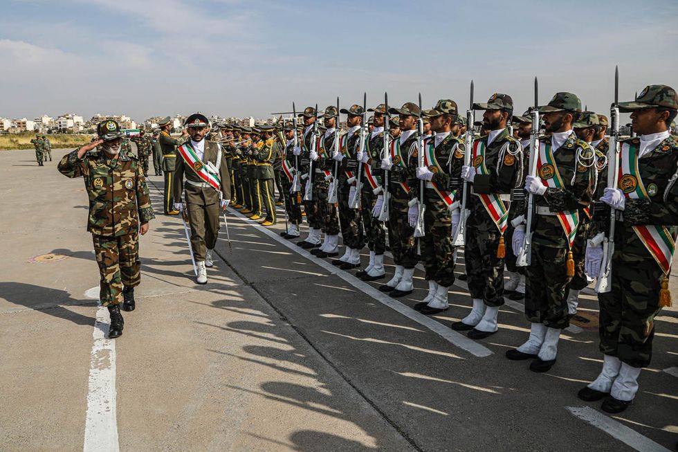 Photograph of the Commander-in-Chief of the Islamic Republic of Iran Army visiting troops during a drill