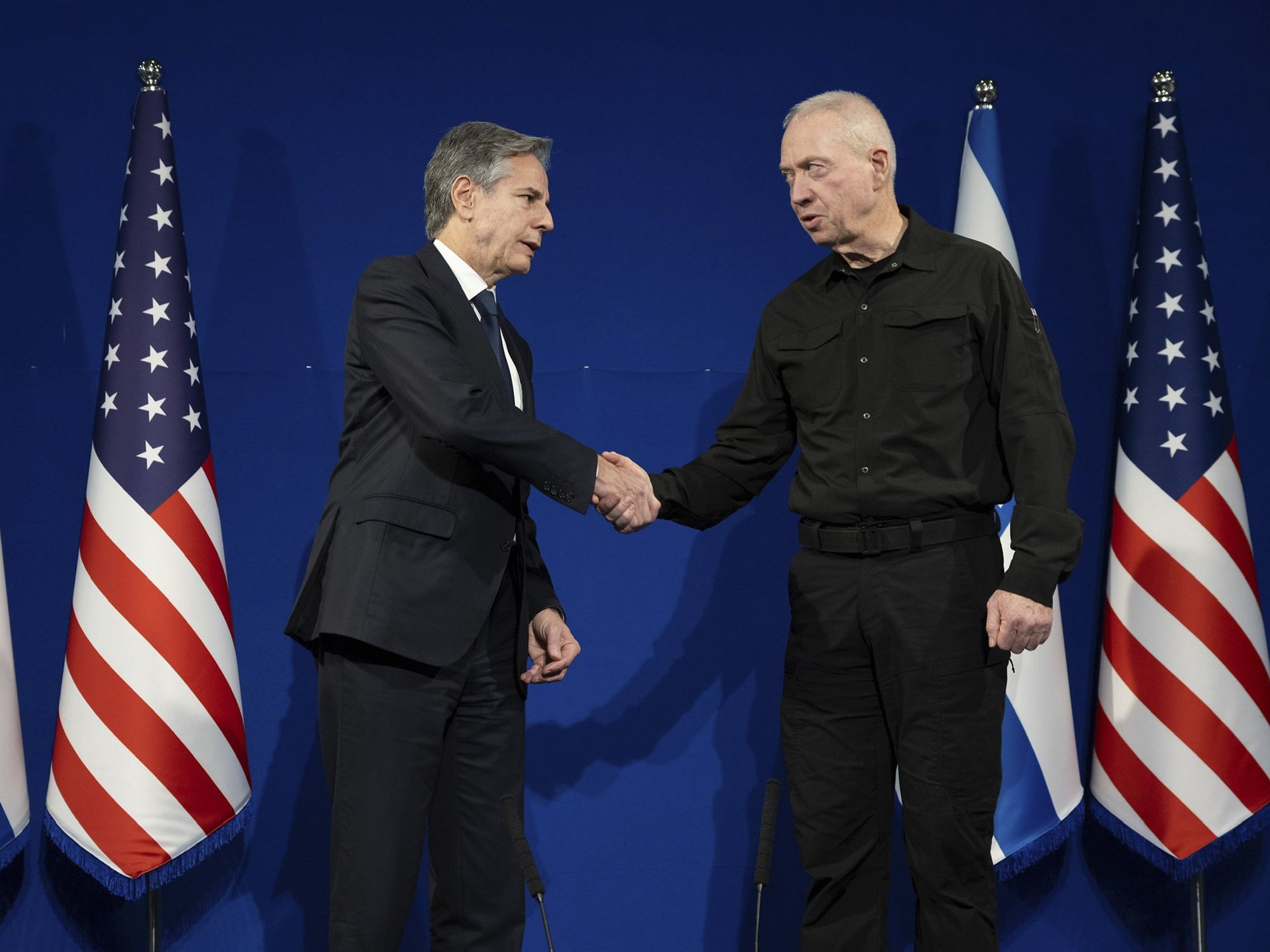 Photograph of U.S Secretary of State Antony Blinken shaking hands with sraeli Defense Minister Yoav Gallant.