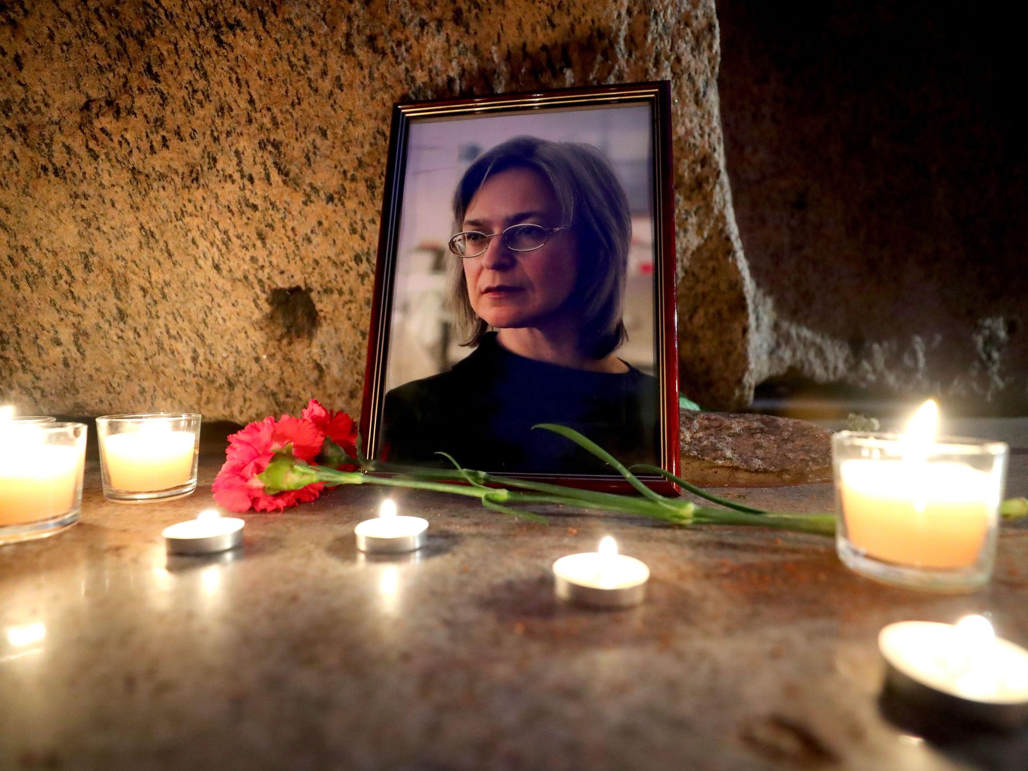 photos of a candlelit memorial for slain Russian journalist Anna Politkovskay