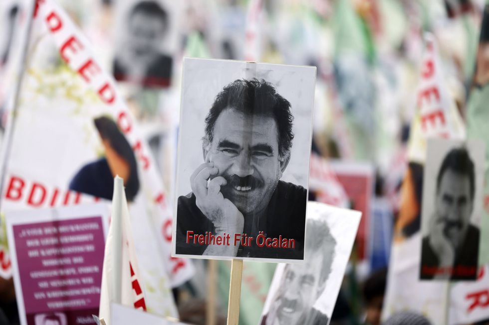 Photos of placards asking for the liberation during a pro-Kurdish demonstration in Germany