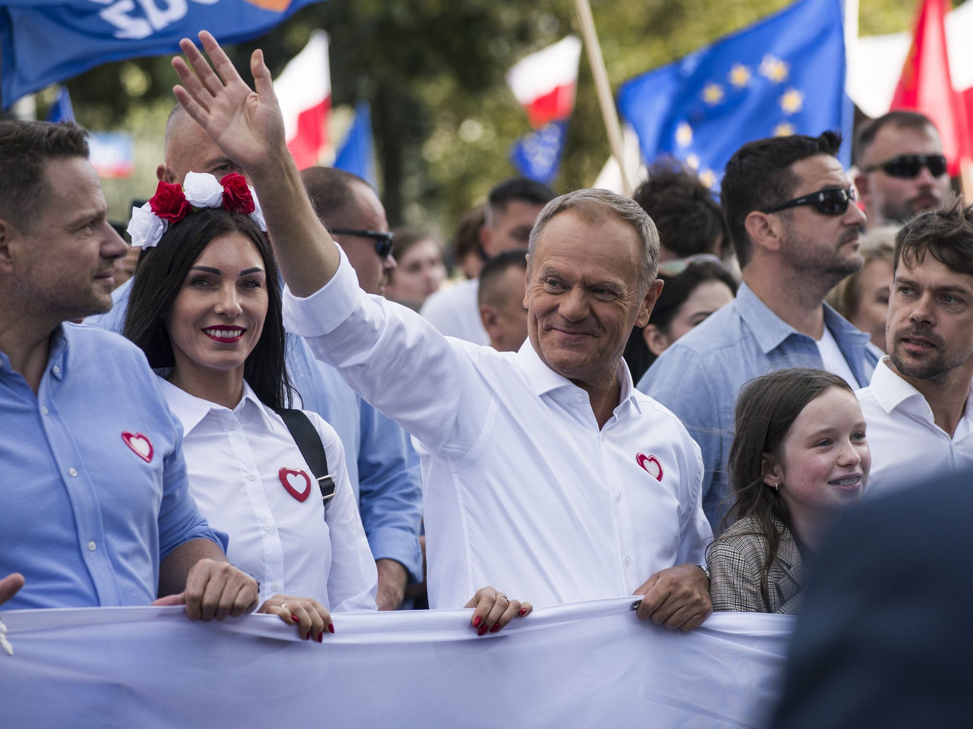 picture of Donald Tusk waving at supporters during the Million Hearts March, protesting the nationalist conservative government.