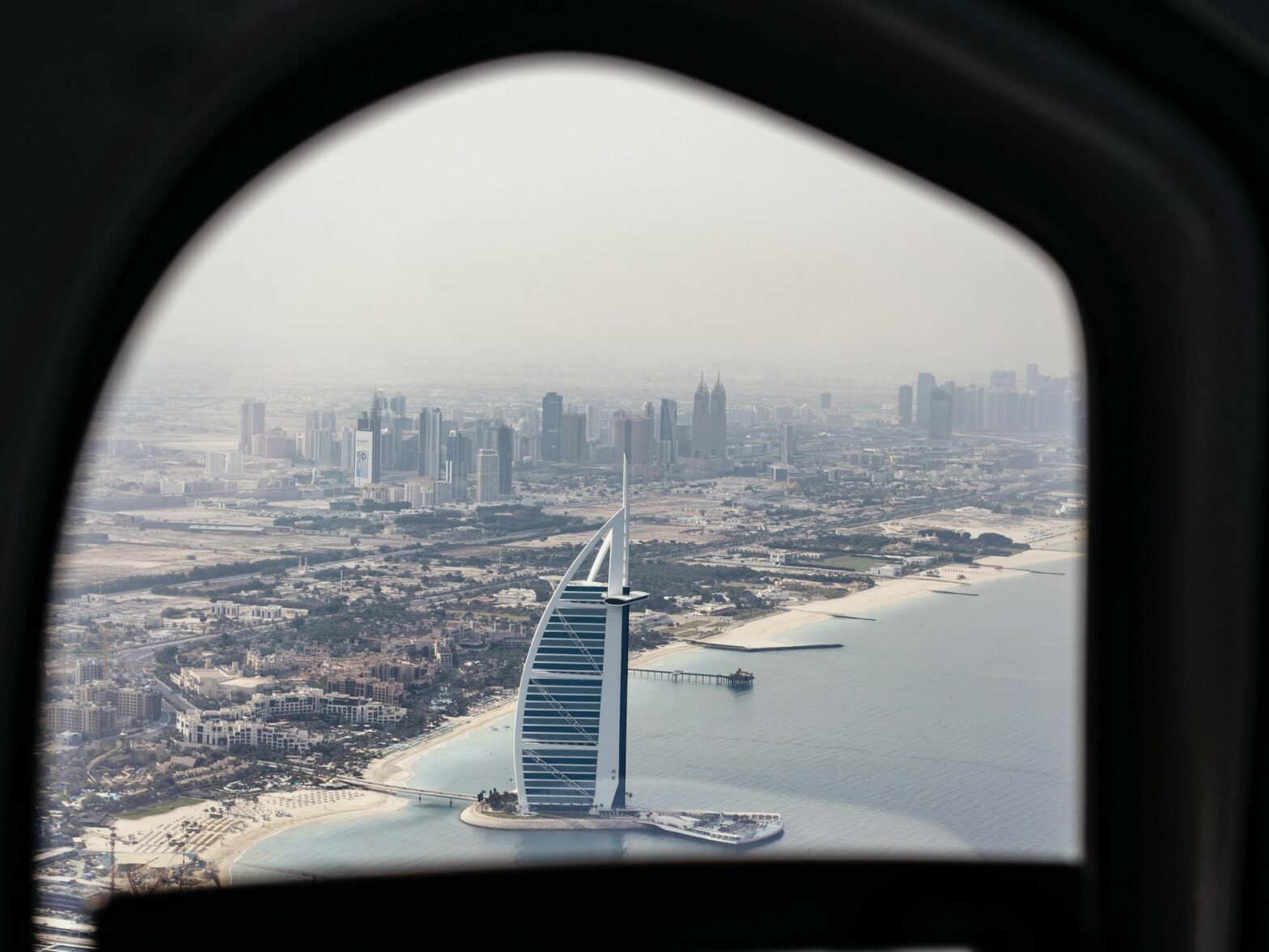 Picture of the Burj Al Arab hotel from the window of an aeroplane