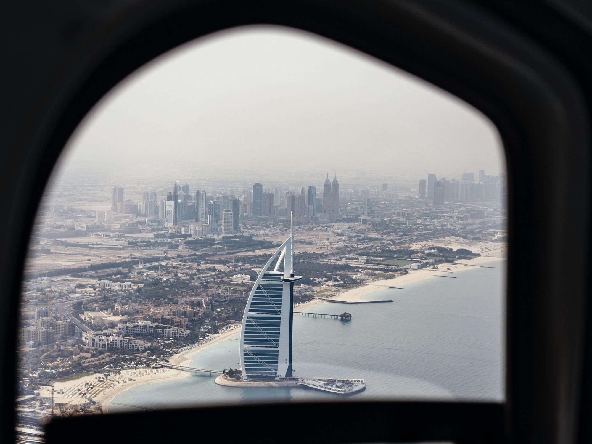 Picture of the Burj Al Arab hotel from the window of an aeroplane
