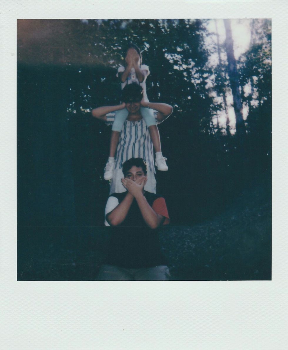 Polaroid of children having fun outdoors.