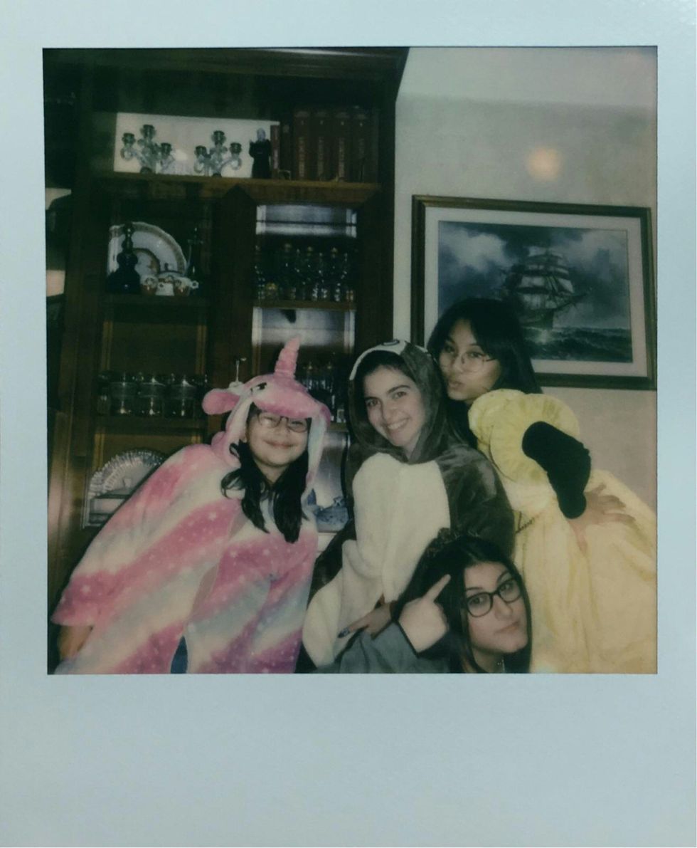 Polaroid of cousins having fun playing dress up.