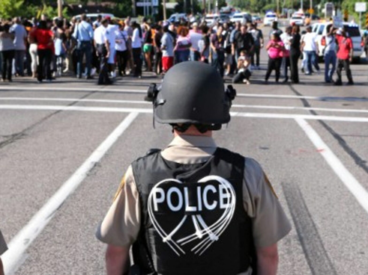 Police await protesters in Ferguson on Aug. 13.