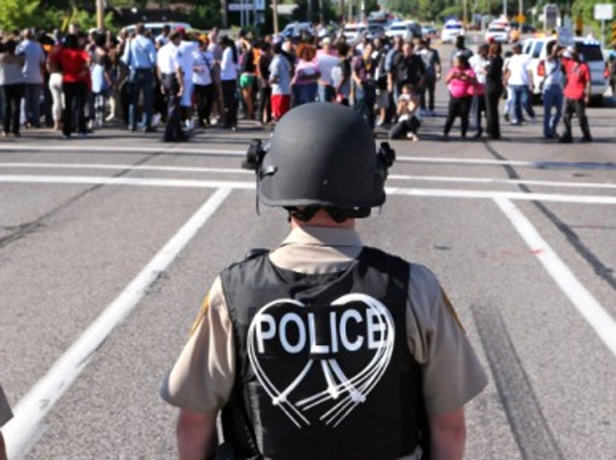Police await protesters in Ferguson on Aug. 13.