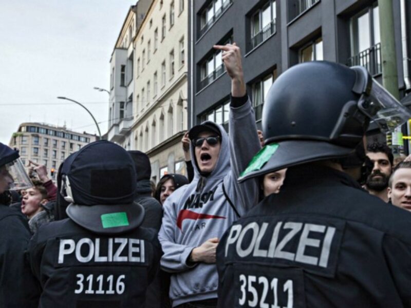 Police block left wing counter-protesters opposing a right wing demonstration in Berlin.