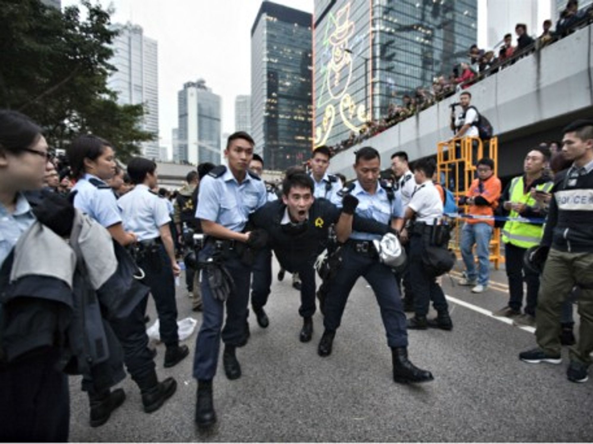 Police dismantling the Occupy Central HQ in Hong Kong on Dec. 11