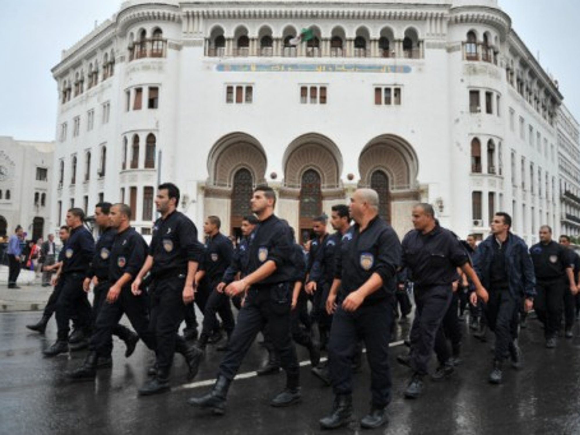 Police in Algiers earlier this month marching in protest.