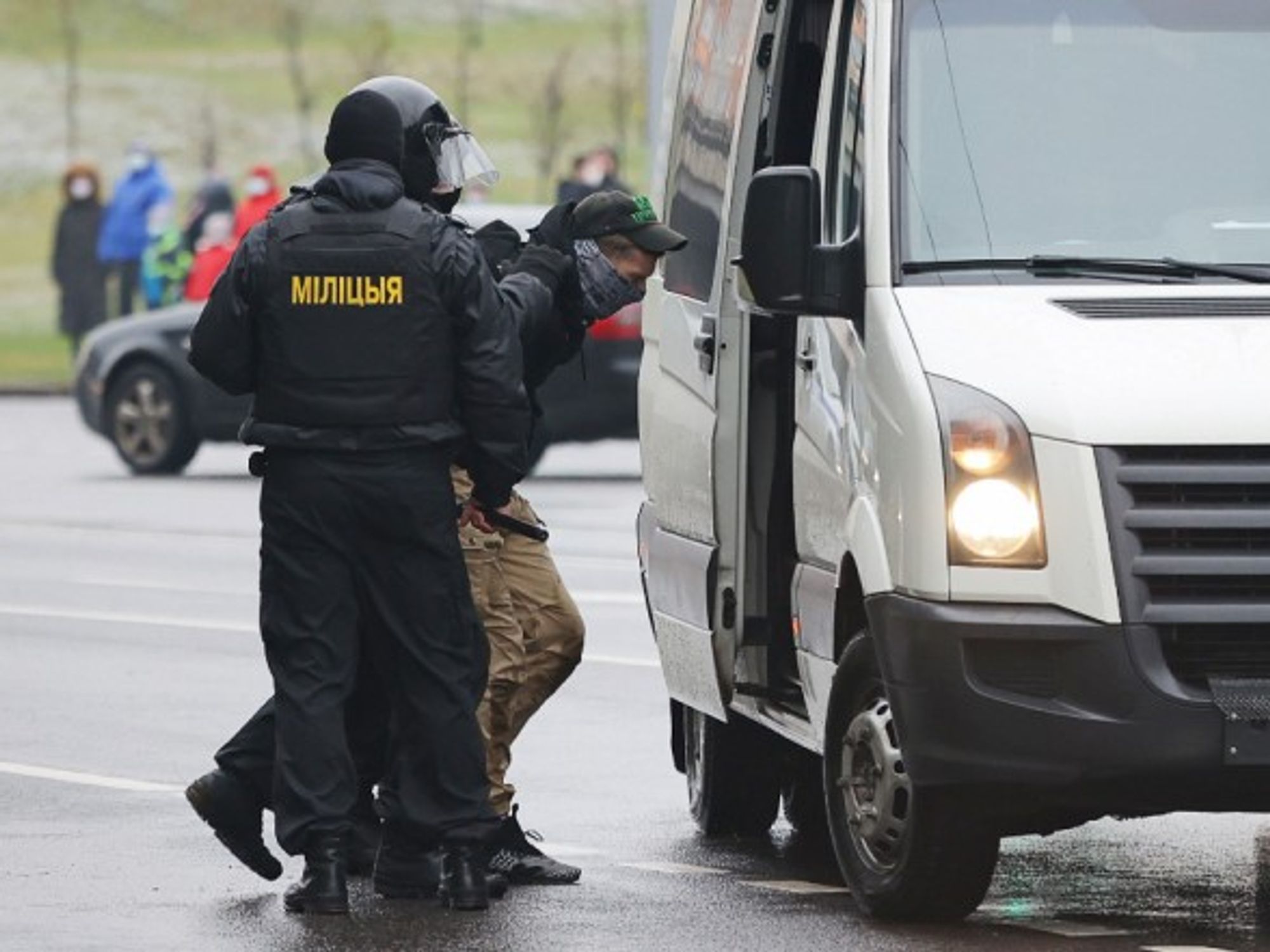 Police offers arresting a protester during a rally in central Minsk in November 2020