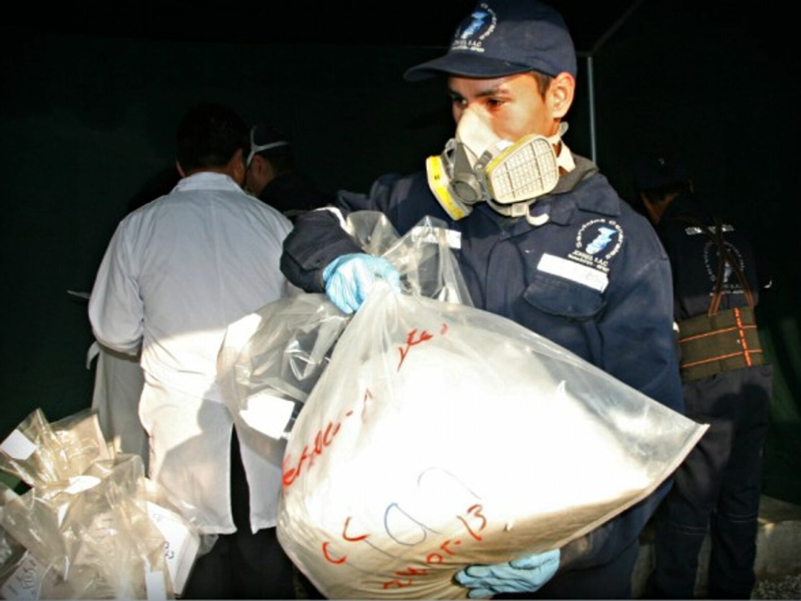 Police officer seizing drugs in Ate Vitarte, Peru