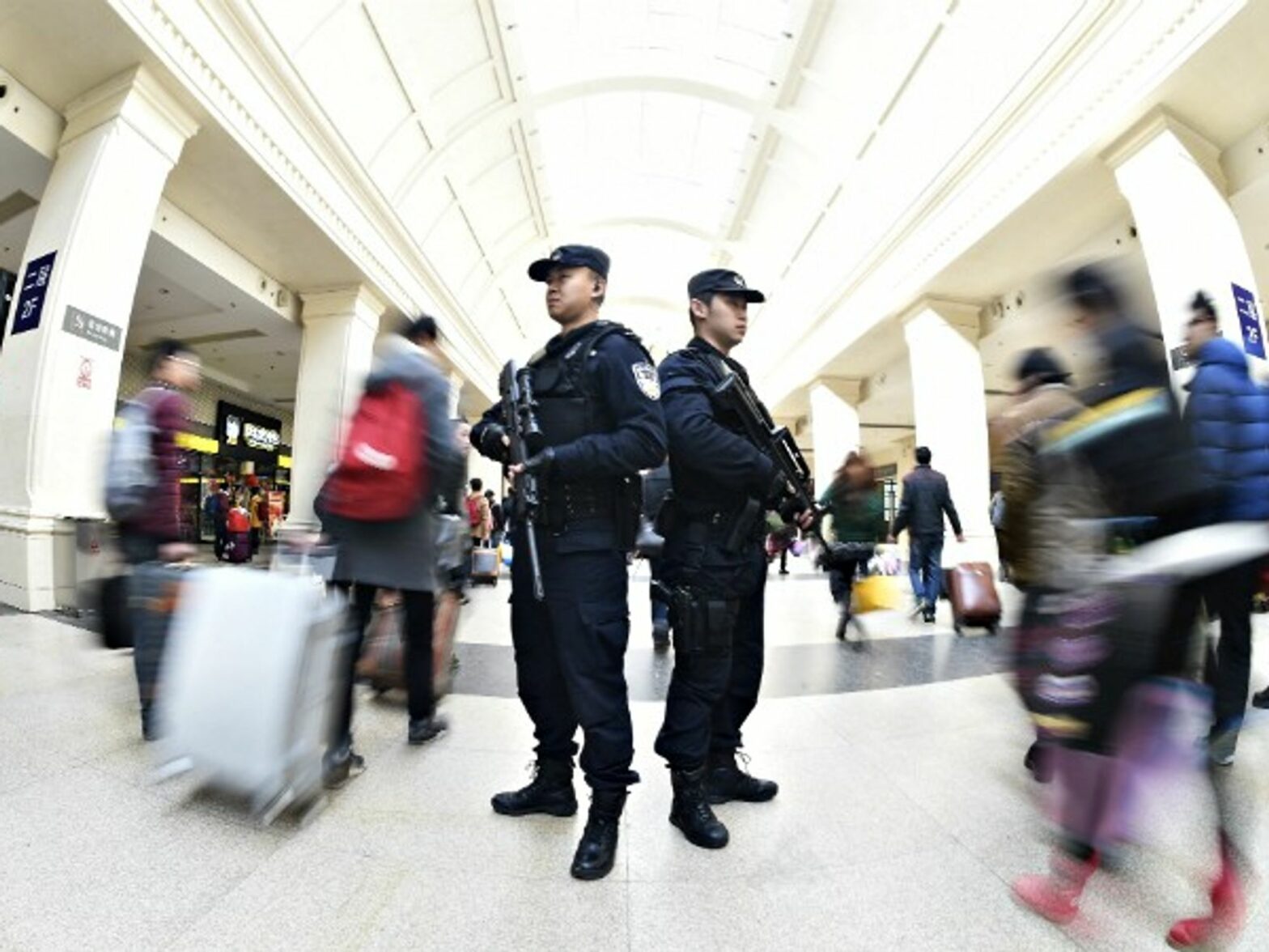 Police officers on duty in a railway station in Wuhan