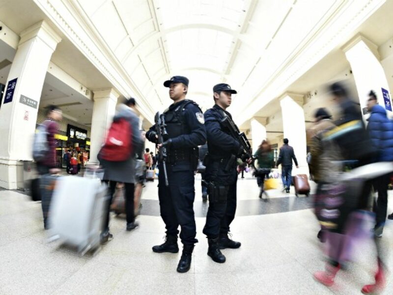 Police officers on duty in a railway station in Wuhan