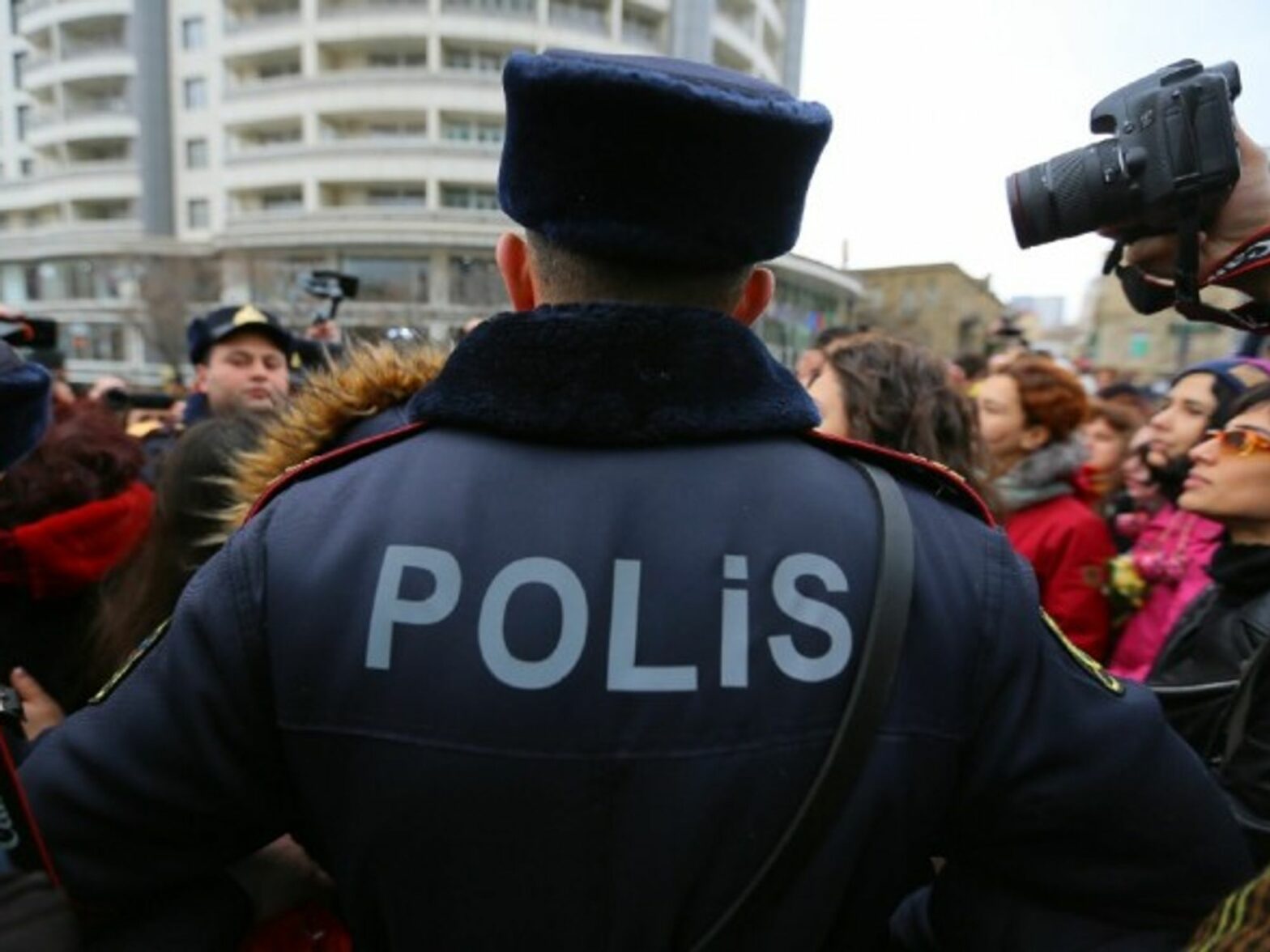 Police officers stop protesters against domestic violence, in Baku, the capital city of Azerbaijan, in March 2019.