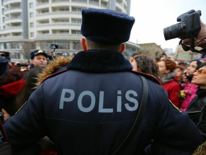Police officers stop protesters against domestic violence, in Baku, the capital city of Azerbaijan, in March 2019.