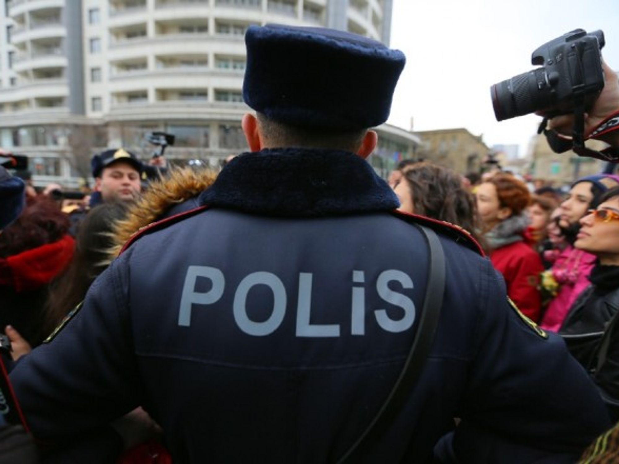 Police officers stop protesters against domestic violence, in Baku, the capital city of Azerbaijan, in March 2019.