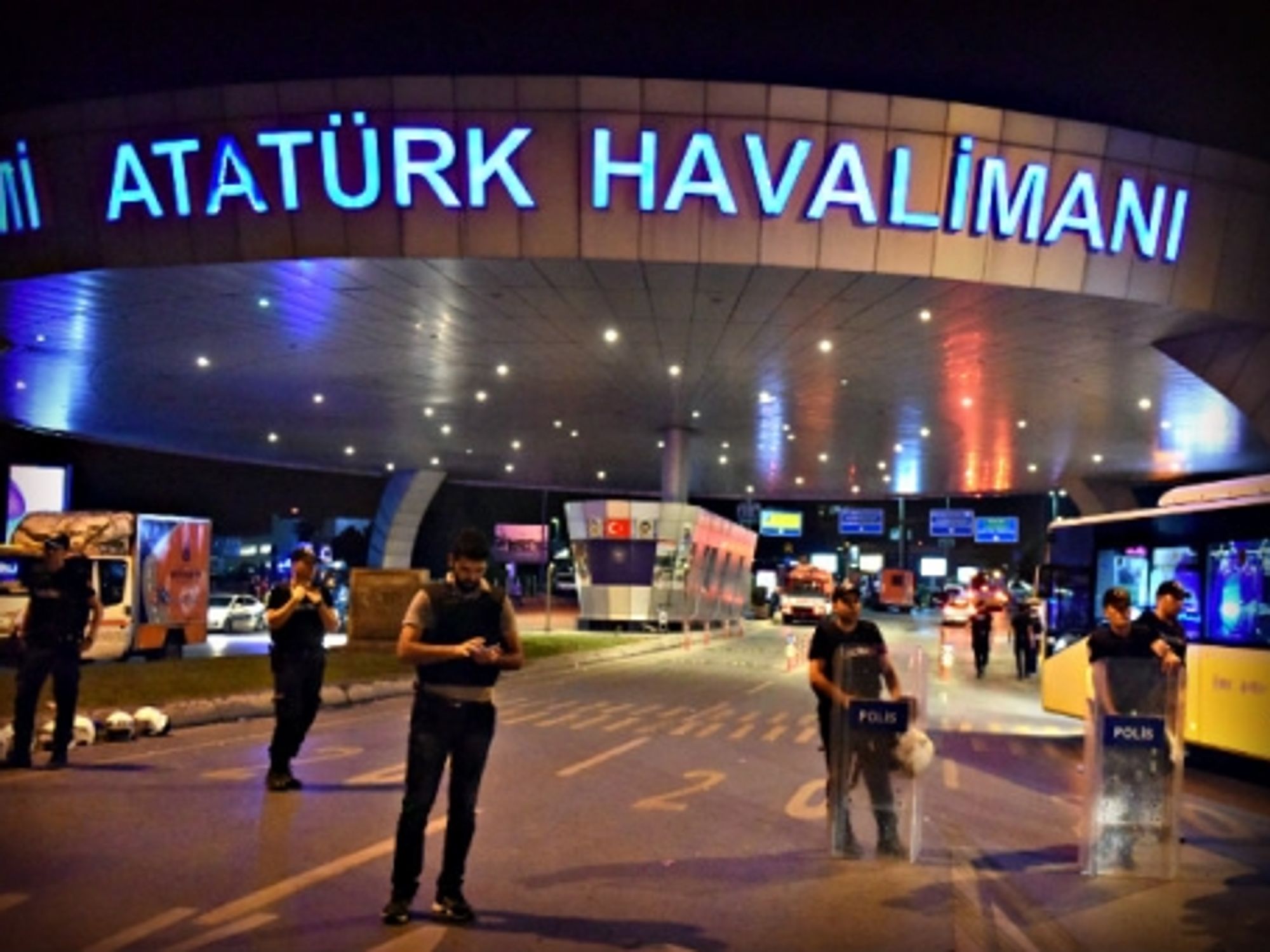 Police officers Tuesday night at the entrance to Istanbul's main airport.