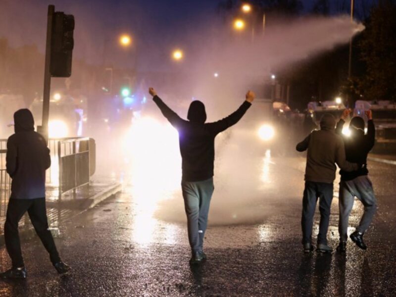 Police using water cannons on protesters in Belfast