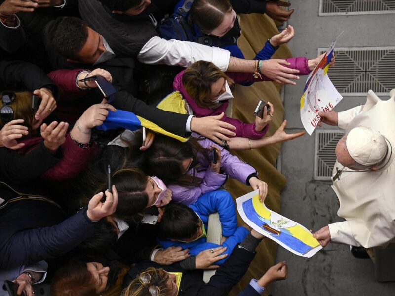 Pope Francis greets children with drawings on Ukraine war