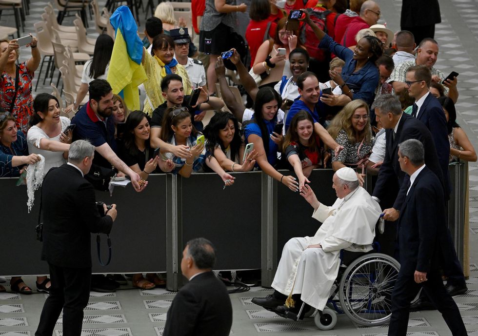 Pope Francis leaves after his weekly general audience