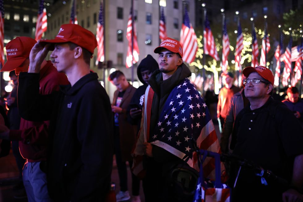 Popular pro-Trump influencer Sneako watches the results of the 2024 U.S. presidential elections on the giant screen set up on Rockefeller plaza, Manhattan, New York.