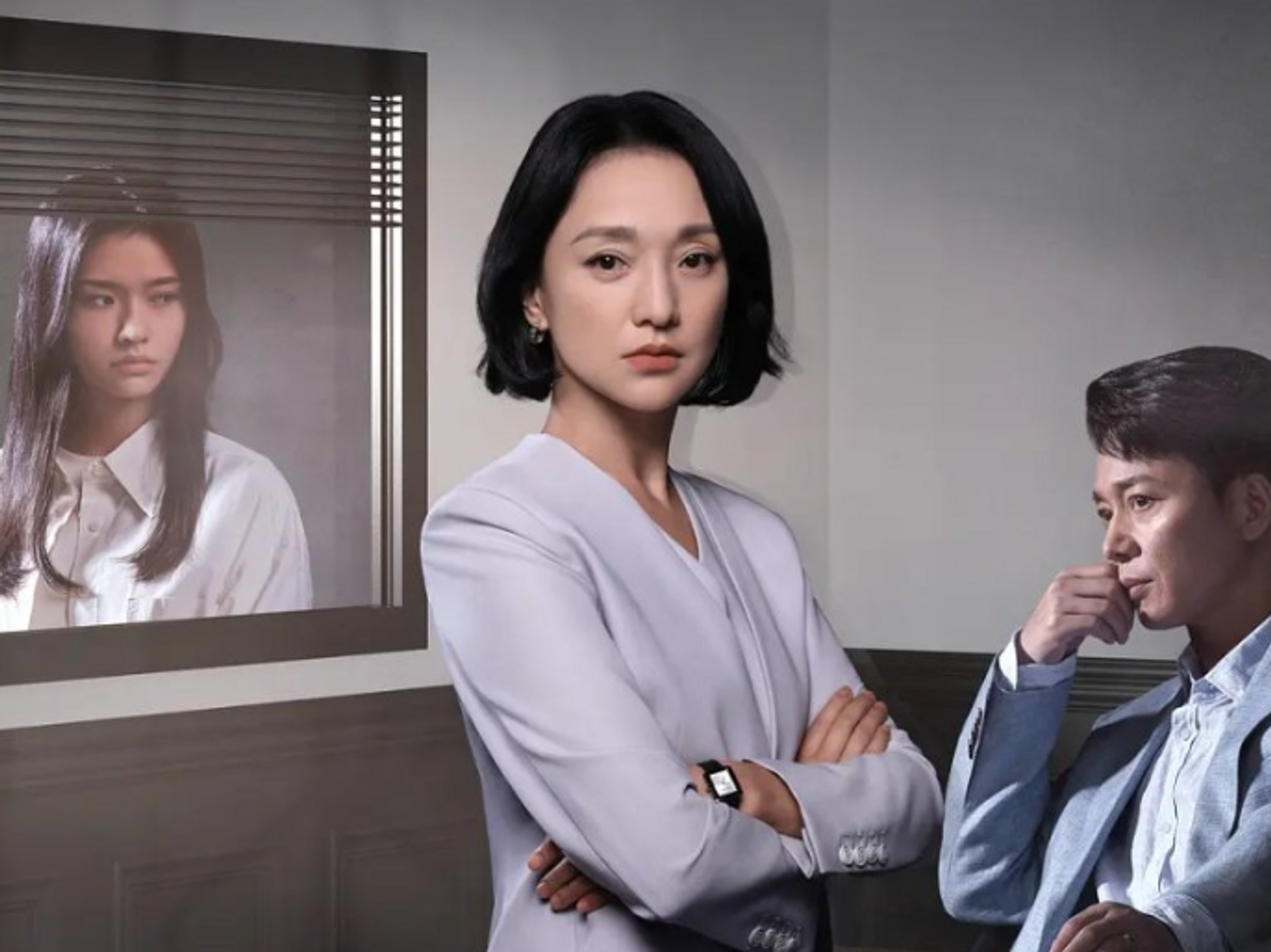 Poster from a series showing two women and a man.