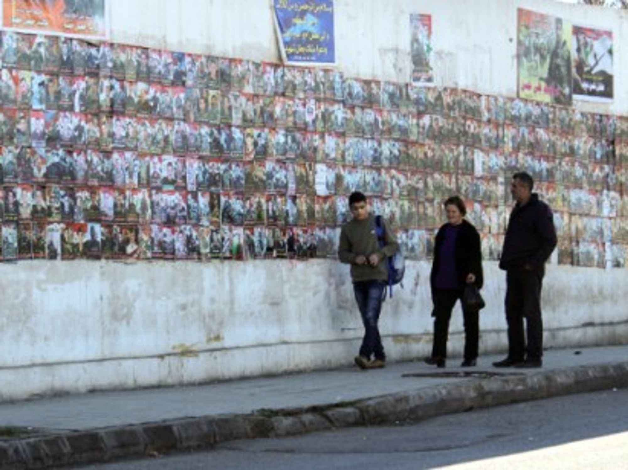 Posters of the missing or dead loved ones are hung around the city's walls