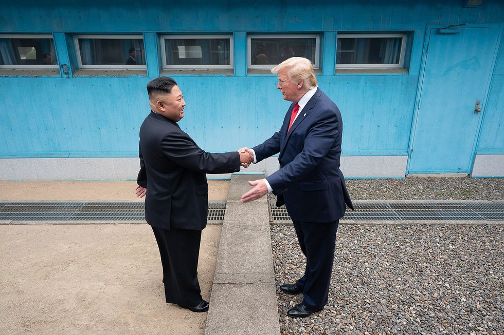 President Donald J. Trump shakes hands with Chairman of the Workers’ Party of Korea Kim Jong Un Sunday, June 30, 2019, as the two leaders meet at the Korean Demilitarized Zone.