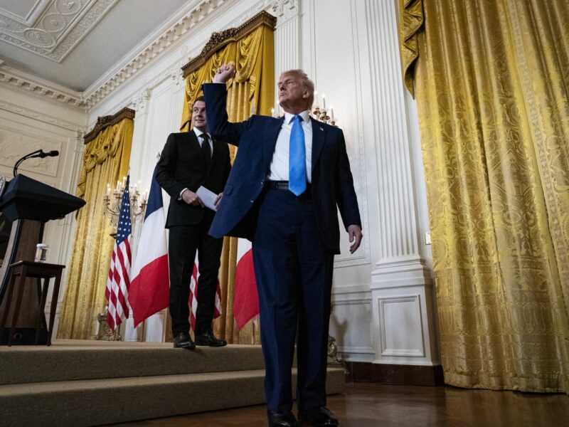 President Emmanuel Macron of France, left, and United States President Donald Trump depart during a news conference in the East Room of the White House in Washington, DC, US, on Monday, Feb. 24, 2025.