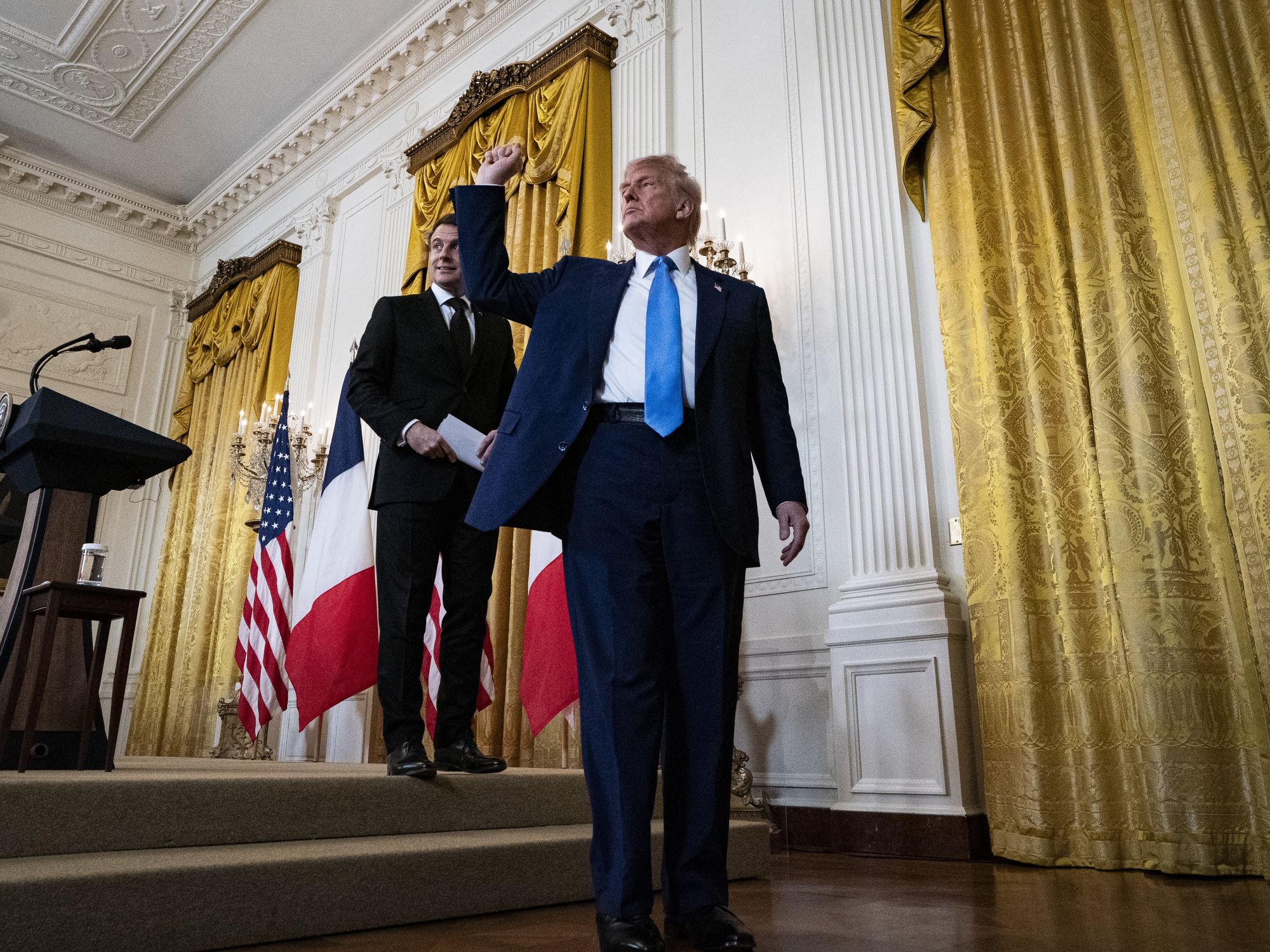President Emmanuel Macron of France, left, and United States President Donald Trump depart during a news conference in the East Room of the White House in Washington, DC, US, on Monday, Feb. 24, 2025.