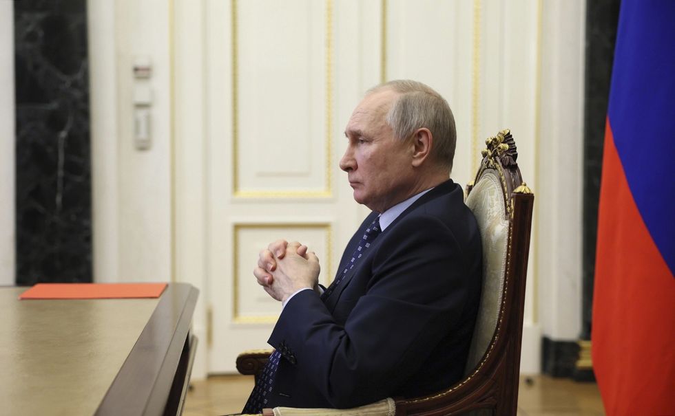 President Vladimir Putin in his office during a video conference.