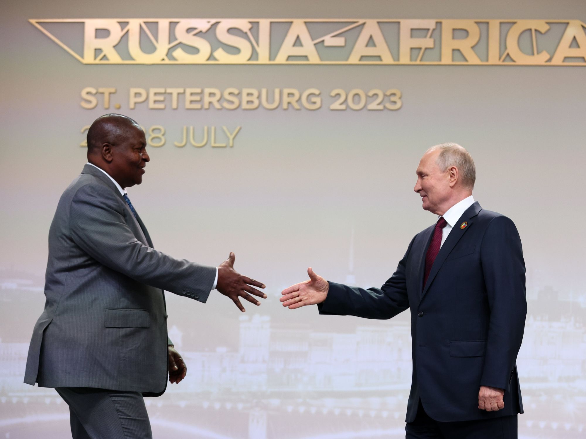 President Vladimir Putin shakes hands with President Faustin-Archange Touadera