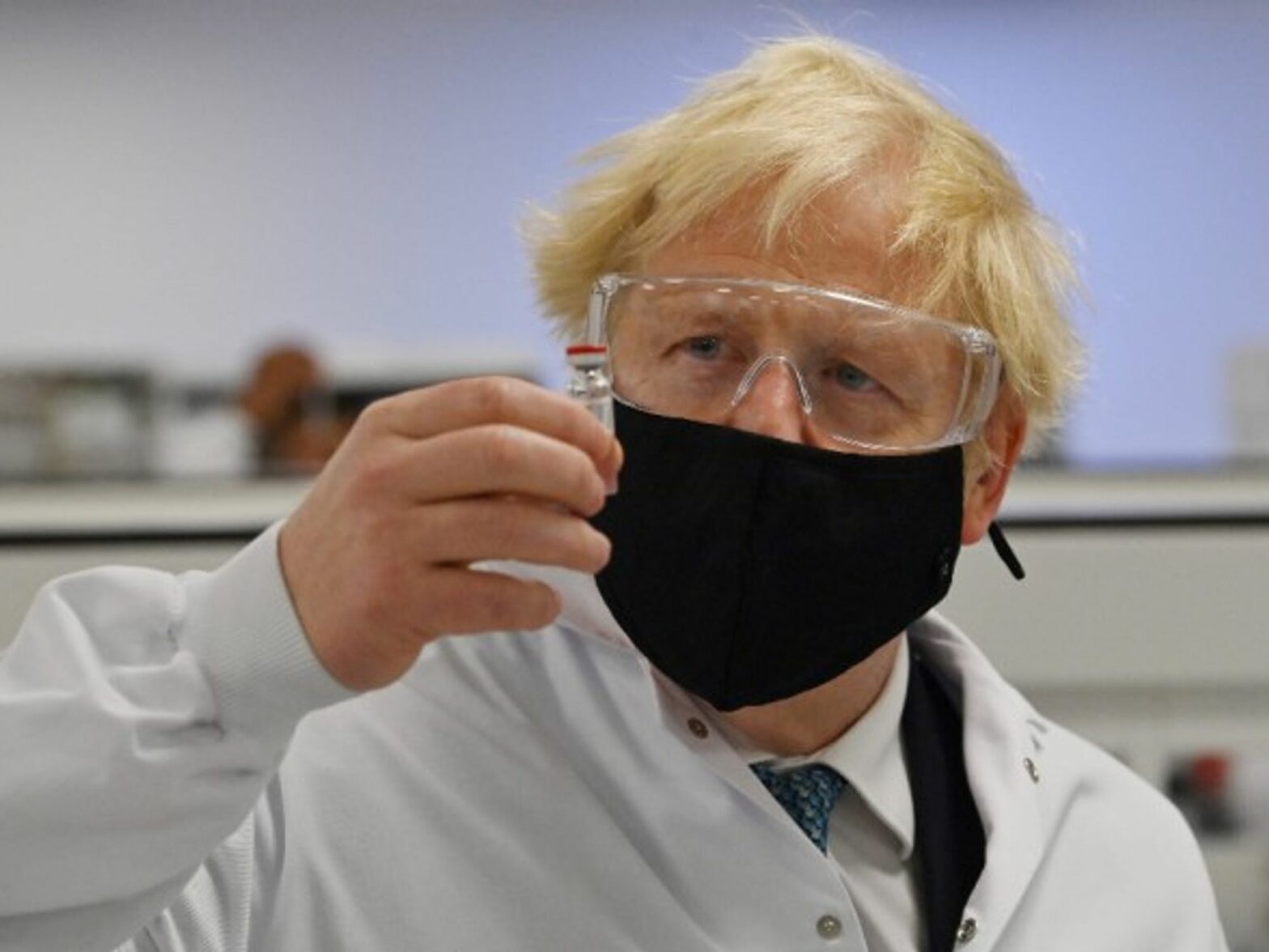 Prime Minister Boris Johnson holds a vial of the Oxford/AstraZeneca vaccine Covid-19 candidate vaccine