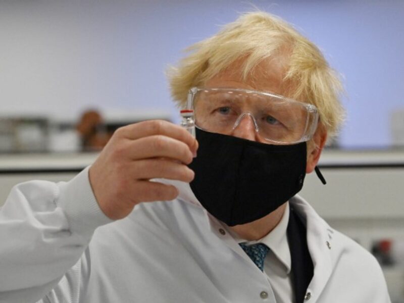 Prime Minister Boris Johnson holds a vial of the Oxford/AstraZeneca vaccine Covid-19 candidate vaccine
