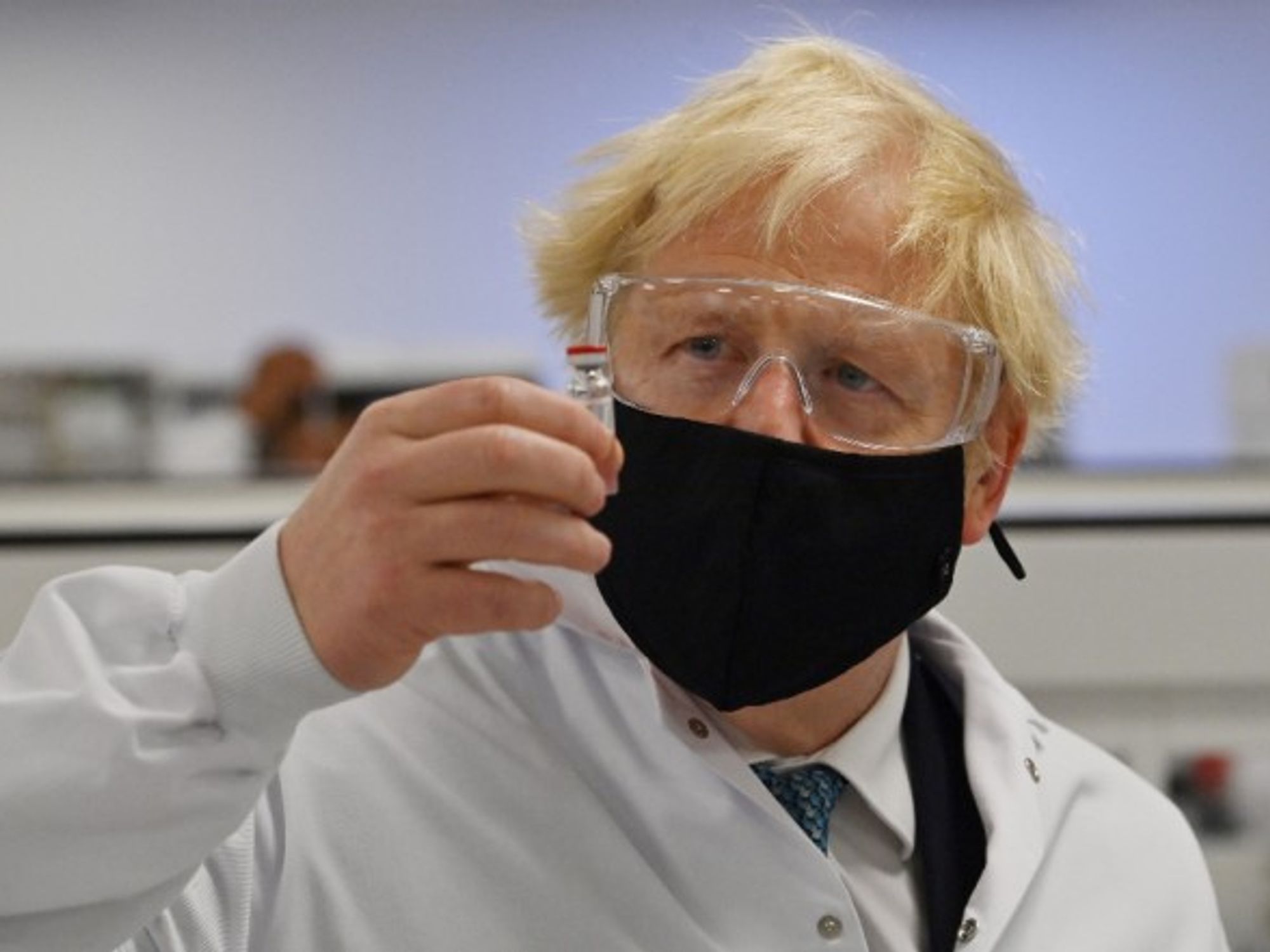 Prime Minister Boris Johnson holds a vial of the Oxford/AstraZeneca vaccine Covid-19 candidate vaccine